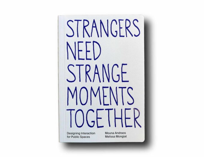Strangers-Need-Strange-Moments-Together-kansi Photo showing the book Strangers Need Strange Moments Together